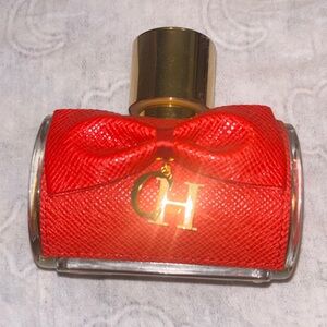 Carolina Herrera Red Perfume Bottle with Gold Accents